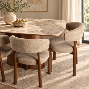 Walnut dining table with curved marble-look top and beige upholstered dining chairs