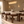 Walnut dining chair set around oval dining table, beige upholstered back