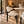 Oval micro cement dining table with cream bouclé chairs