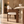 Walnut dining chair with beige textured upholstery and rounded arms
