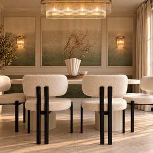 Oval micro cement dining table with six black bouclé dining chairs