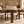 Walnut dining chair with beige seat cushion and wide backrest