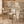 Single upholstered oak barstool with curved backrest, light beige seat, slim legs