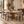 Dining chairs in walnut with light gray upholstered backs and seats