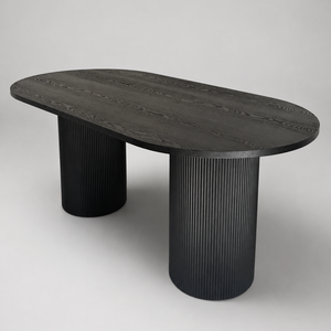 A modern oval dining table with a dark wood-grain top and two fluted cylindrical pedestal legs, shown on a neutral light gray background.