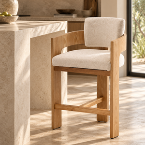 Light oak barstool with cream upholstered seat, wide arms, open bottom footrest