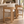 Light oak barstool with cream upholstered seat and back, open lattice support frame