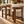Walnut barstool with cream fabric seat and back, showing square apron and footrest