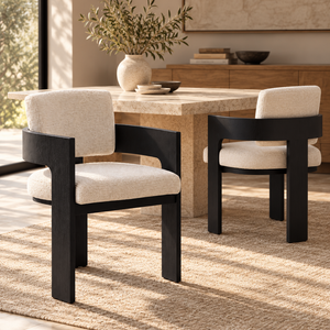 Pair of cream dining chairs with dark wood frames and armrests