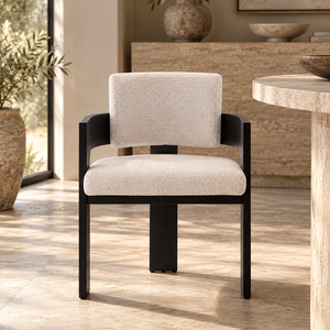 Cream upholstered dining chair with dark wood arms and legs