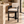 Black wood barstool with cream upholstered seat and curved backrest