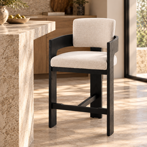 Black wood barstool with cream upholstered seat and curved backrest