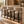 Set of barstools with light gray upholstered seats and backs, black legs.