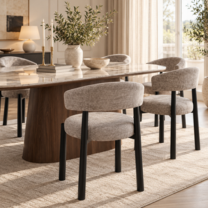 Gray fabric dining chair with curved back and black legs for table seating