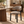 Gray upholstered dining chair with curved back and black tapered legs