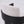 Close-up of a modern chair back with a textured off-white fabric cushion and a curved black wooden frame, shown against a plain white background.