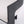 Close-up of a modern upholstered chair or bench corner, showing a light beige textured fabric seat with a dark charcoal wood frame on a white background.