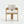 A modern wooden armchair with a light beige textured fabric seat and backrest, shown from the front against a clean white studio background.