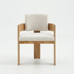 A modern wooden armchair with a light beige textured fabric seat and backrest, shown from the front against a clean white studio background.