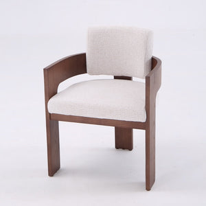 A modern accent chair featuring a dark brown wooden frame and light beige textured fabric upholstery on the seat and backrest, shown against a plain white studio background.