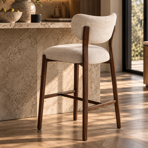Walnut barstool with light beige upholstered seat and curved backrest, footrest brace