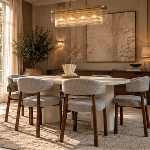 Oval dining table with six walnut dining chairs in light gray fabric upholstery