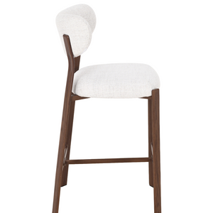 Light upholstered barstool with rounded back, dark walnut legs and side frame