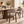 Walnut dining chair with light gray upholstered seat and rounded backrest