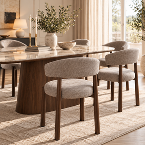 Walnut dining chair with light gray upholstered seat and rounded backrest