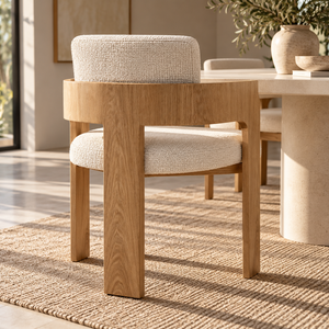 Cream upholstered dining chair with oak frame and armrests, straight legs