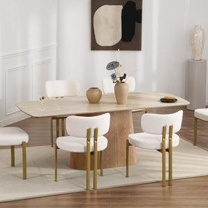Dining room with a wooden table and white chairs in a modern interior setting.