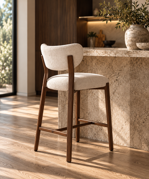 Walnut barstool with light beige upholstered seat, curved backrest, slim walnut legs