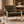 Corra khaki armchair with textured upholstery, broad seat, and polished metal frame