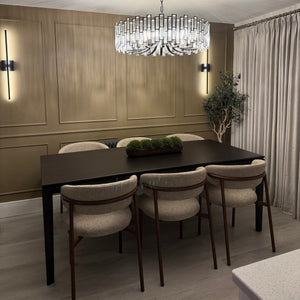 Dining area with a table and chairs in a modern interior setting.