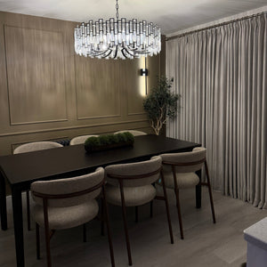 Dining area with a table and chairs in a modern interior setting.