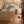 Modern kitchen with wooden beams and a dog standing near the door.