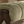 Henry Sage stool detail with sage-green upholstered cushion and dark wood frame