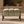 Henry Sage stool with three padded sage-green sections and dark wood legs
